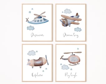 May include: Set of four watercolor prints featuring blue and brown airplanes and helicopters with inspirational quotes. The prints say "Discover", "Dream Big", "Explore", and "Fly High".