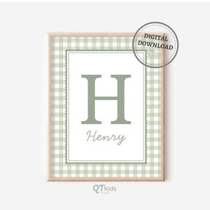May include: A framed print featuring the letter "H" in a soft green hue, with the name "Henry" below. The design includes a gingham pattern border in light green and white, and a "Digital Download" seal.