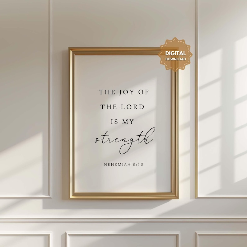May include: A gold framed print with the text "The joy of the Lord is my strength" and the scripture reference "Nehemiah 8:10".