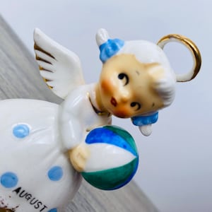 Rare Norcrest August Birthday Spaghetti Angel Figurine Bell with Beach Ball