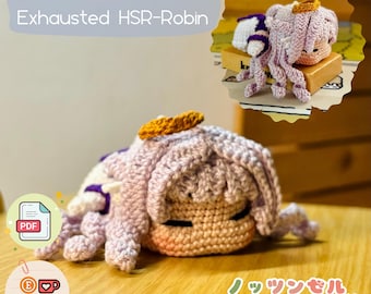 May include: A crocheted plush toy of a character with purple hair and a halo. The toy is lying on its side with its eyes closed. The toy is labeled "PDF ONLY Exhausted HSR-Robin" and "Knotunzel".