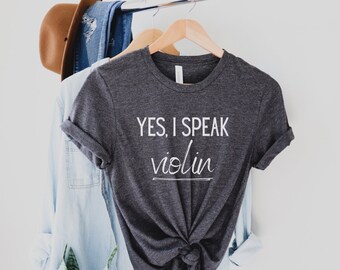 May include: A dark gray t-shirt with the text "YES, I SPEAK violin" printed in white.