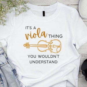 May include: White t-shirt with the text "It's a viola thing you wouldn't understand" and a drawing of a viola in orange.