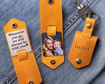 May include: Three yellow leather keychains with a photo, a message, and the word "DADDY".
