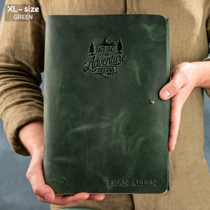 May include: A green leather journal with the text "And so the adventure begins" and a mountain range graphic. The journal is personalized with the name "Fran Allen".