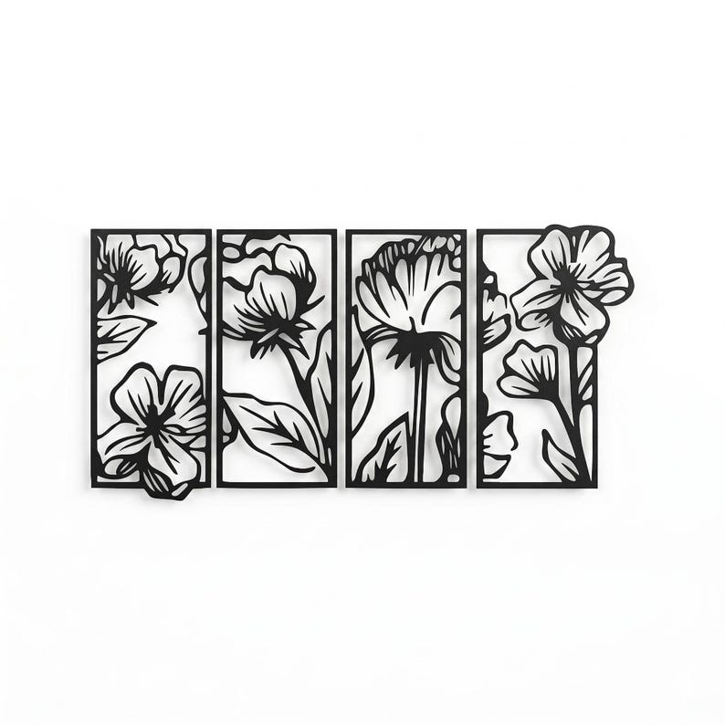 May include: Black metal floral wall art. The artwork features four rectangular panels with cut-out designs of various flowers and leaves. The flowers are in different stages of bloom, creating a dynamic and artistic display. The piece is designed to be mounted on a wall.