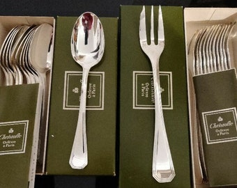 12 Christofle teaspoons and 12 forks, new in original packaging