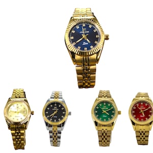 May include: Five wristwatches with gold, silver, and black metal bands. The watches have different colored faces: blue, gold, green, and red.