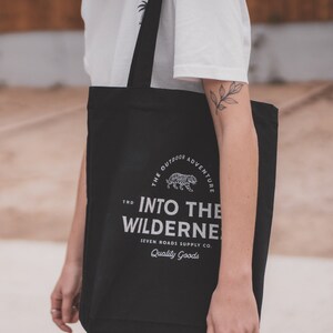 Unisex black tote bag in Recycled Organic Cotton Into The Wilderness image 1