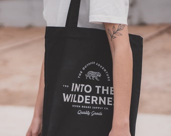 Unisex black tote bag in Recycled Organic Cotton "Into The Wilderness"