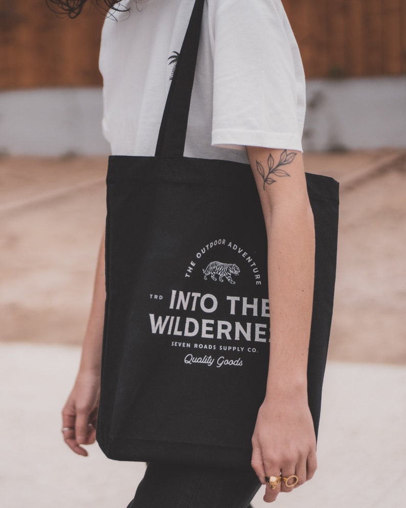 Unisex black tote bag in Recycled Organic Cotton Into The Wilderness image 1