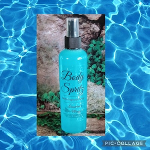 May include: A blue plastic bottle with a black spray nozzle and a white label that reads "Body Spritz Body Fragrance Spray Lauren's Wings".