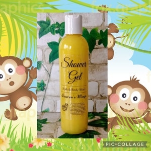 May include: A yellow shower gel bottle with a white cap. The label reads "Shower Gel, Bath & Body Wash, Lauren's Wings." The background features cartoon monkeys and jungle foliage, creating a playful, tropical theme.