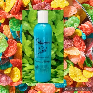 May include: A blue plastic bottle of shower gel with the words "Shower Gel" and "Bath & Body Wash" printed on the front. The label also includes the text "Lauren's Wings".