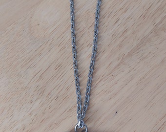 A.R.Ottosson, Sweden, tenn,handmade pendant on chain with dog pattern .