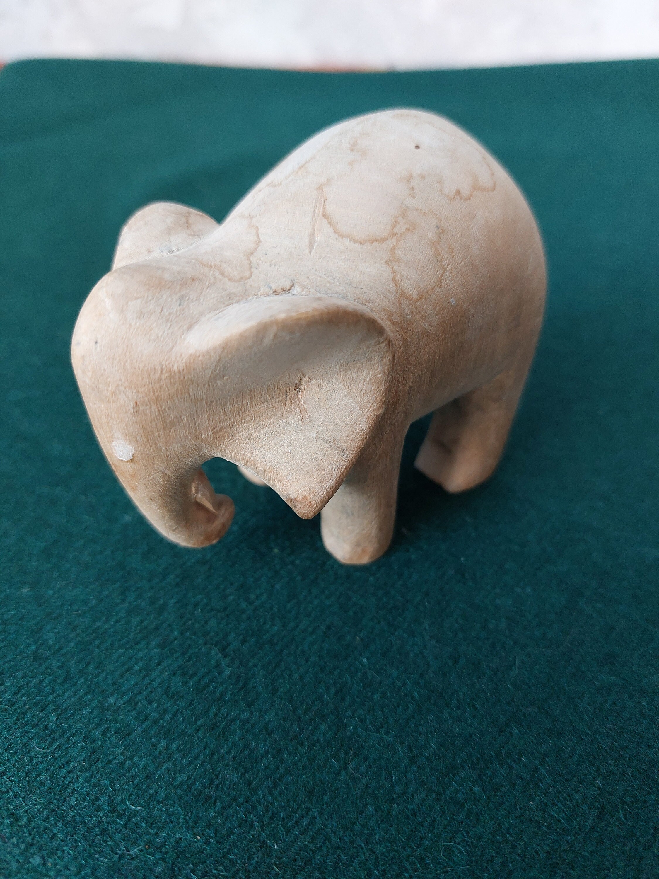 Vintage hand carved wooden elephant figurine.