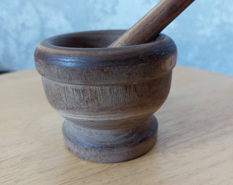 Wooden vintage Mortar and pestle made of solid wood.