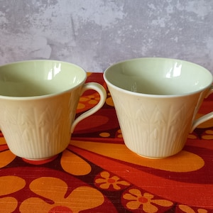 Set of two tea cups,yellow Linnea, design Hertha Bengtsson?,modell VB Rörstrand,Sweden.