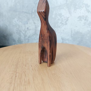 Funny hand carved wooden figurine of a cat.Skandinavian design.