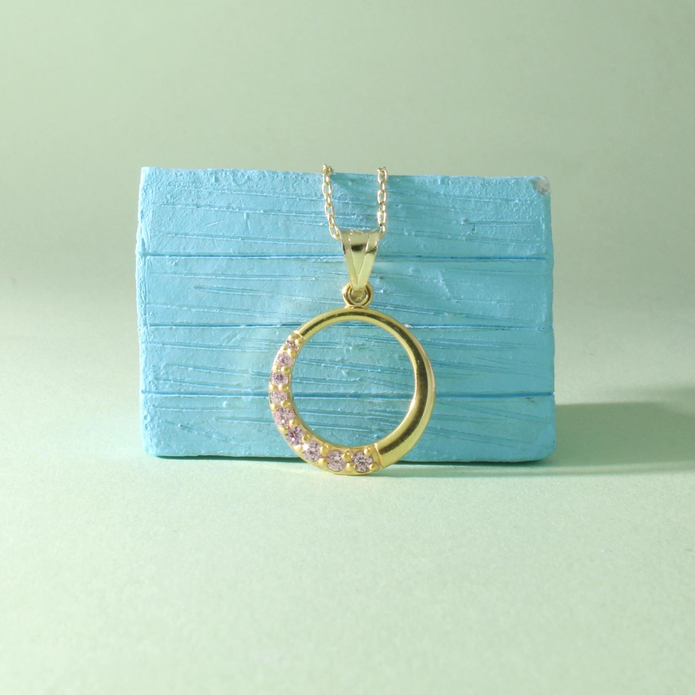 Gold hook pendant deals