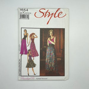 May include: A sewing pattern for a skirt with three different styles. The pattern is for sizes 8, 10, and 12. The pattern is called "Style" and the number is 1654.