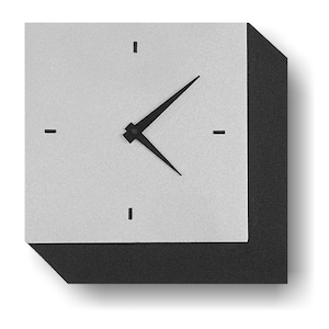 May include: A square wall clock with a light gray face and black hands and frame. The clock has simple black markers at the 12, 3, 6, and 9 o'clock positions. The hands are black and pointed.