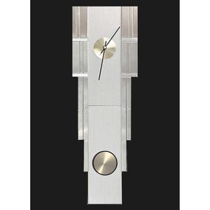 May include: A silver and white modern wall clock with a round face and black hands. The clock has a unique design with vertical strips of metal.