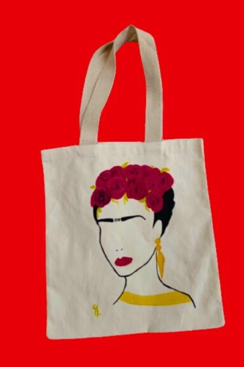 Frida Kahlo figure handpainted on cotton tote bag using textile colors.