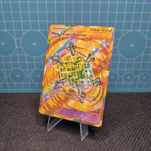 May include: A set of three ceramic mugs with a speckled, matte finish. The mugs are in shades of cream, light gray, and dark gray. Each mug has a simple, minimalist design, perfect for coffee or tea.