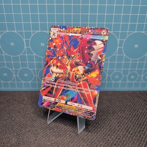 May include: A set of three ceramic mugs with a speckled, matte finish. The mugs are in shades of cream, light gray, and dark gray. Each mug has a simple, modern design and a rounded handle. Perfect for coffee or tea.