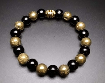 Bracelet en perles noires et dorées - 10 mm