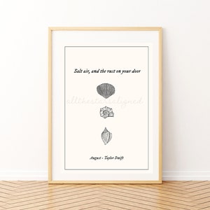May include: A printable art print with a white background and black text that reads "Salt air, and the rust on your door, all the stars aligned, August - Taylor Swift". There are three black and white illustrations of seashells.
