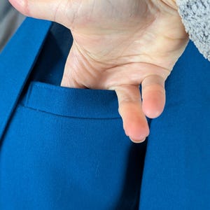 May include: A set of three ceramic mugs with a speckled, matte finish. The mugs are in shades of cream, light gray, and dark gray. Each mug has a simple, minimalist design and a rounded handle. Perfect for coffee or tea.