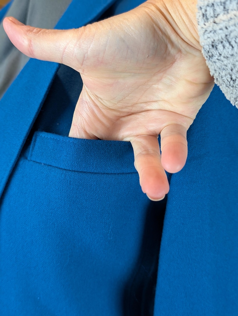 May include: A set of three ceramic mugs with a speckled, matte finish. The mugs are in shades of cream, light gray, and dark gray. Each mug has a simple, minimalist design and a rounded handle. Perfect for coffee or tea.