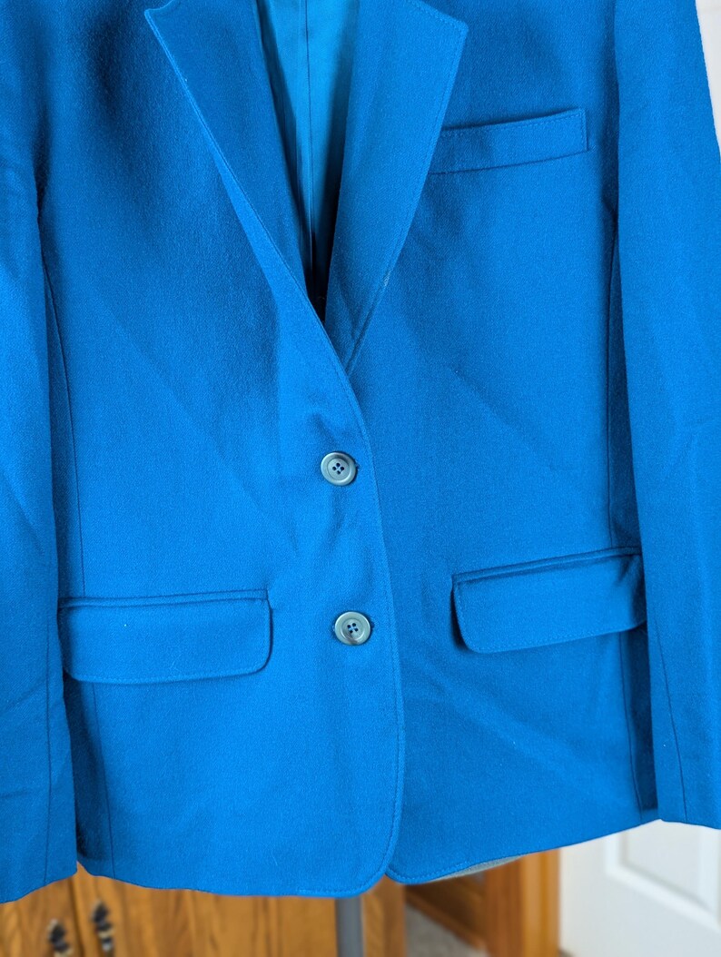 May include: A rustic wooden sign with the text "Welcome to our home" in white lettering. The sign features a distressed finish and a simple, inviting design, perfect for entryway decor.