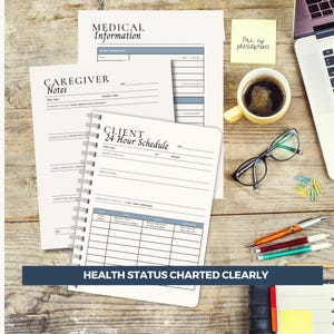 A caregiver planner on a wooden desk with medical forms, a notebook, and a laptop. The notebook is labeled "CLIENT 24 Hour Schedule" and has a chart for tracking health status. A sticky note reads "Pick up prescriptions."