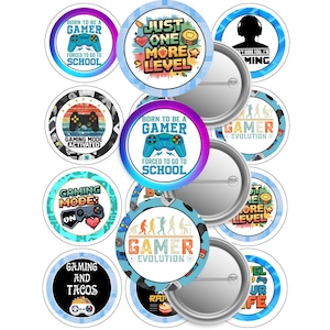 May include: Twelve round, colorful buttons with gamer-themed text and graphics. The buttons feature phrases like "Born to be a Gamer", "Gaming Mode Activated", and "Just One More Level".