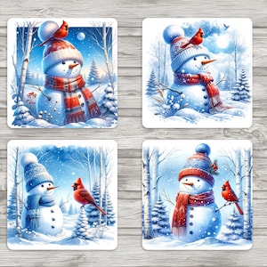 May include: Set of four square coasters featuring winter scenes. Each coaster depicts a snowman wearing a hat and scarf, with a red cardinal bird perched nearby. The snowmen are set against a snowy forest backdrop with falling snowflakes.