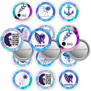 May include: A selection of round pin badges with diverse designs and text. The badges display images of butterflies, feathers, anchors, and floral elements in blue, purple, and teal hues. Some badges feature phrases such as "Choose to Keep Going" and "Into the Darkness I Go Lose My Mind and Find My Soul."