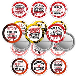 May include: A collection of round pinback buttons with various true crime-themed phrases in red, black, and white. Some buttons feature text like "Fueled by Caffeine and Murder Shows" and "Just a Girl Who Loves True Crime."