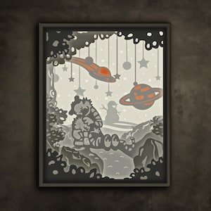 May include: A paper cut-out artwork featuring a bear seated in a woodland setting, with a snowman and a flying saucer visible in the background. The scene is lit with a gentle white light, giving it a whimsical and magical feel.