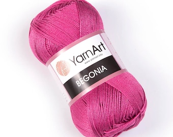 May include: A pink ball of yarn with a label that says "YarnArt" and "BEGONIA".