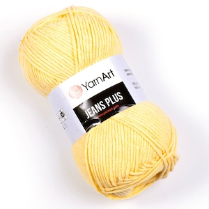 May include: A ball of yellow yarn labeled "YarnArt Jeans Plus" with the website address "www.yarnart.info".