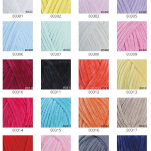 May include: A collection of 21 yarn skeins in various colors, including white, yellow, pink, lavender, light blue, mint green, red, black, orange, beige, coral, turquoise, gray, and blue. Each skein is labeled with a number.
