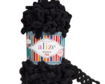 May include: A skein of black Alize Puffy Fine yarn. The yarn is a soft, fluffy texture and is perfect for crocheting or knitting.
