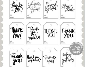 May include: Twelve white gift tags with black handwritten text. Phrases include "thanks a ton!", "Thank You!", "Beyond Grateful!", and "Many Thanks". Each tag has a hole at the top and space for "To:" and "From:" information.