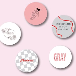 May include: A collection of five circular designs with various graphics and text. One features a line drawing of a person with wings, another has the text "I wish that you would stay in my memories". Other designs include "Checkmate", "SUPERACHE IS FOR VIRGINS", and "GRAY CONAN".