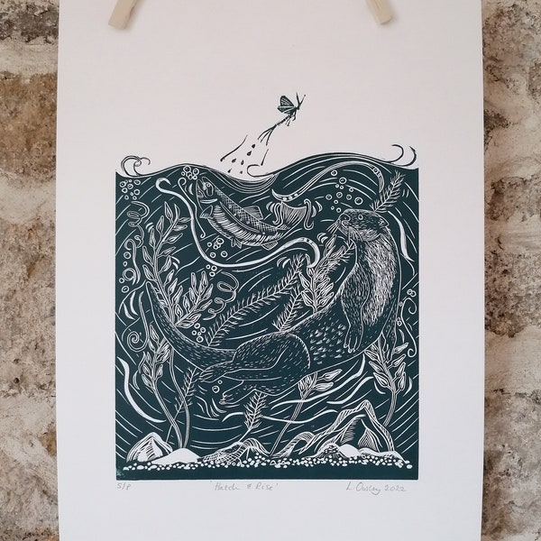 Original lino print of an otter, salmon and mayfly in dark blue ink