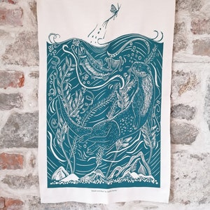 Screen printed otter tea towel from original lino print