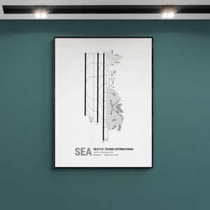 May include: A black and white print of a map of Seattle-Tacoma International Airport (SEA) in Seattle, Washington. The map shows the airport layout, runways, and terminals. The text "SEA Seattle-Tacoma International Seattle, Washington" is printed below the map.